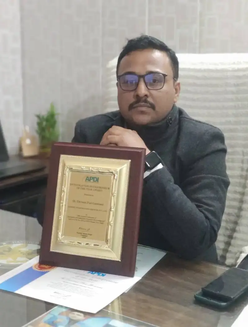 Chamoli detective agency owner Mr. Devvrat sitting in his office with an awards.